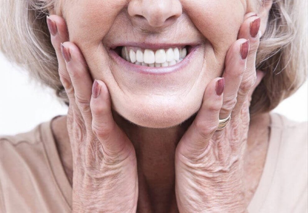 A smiling patient after getting dentures in Saginaw, TX